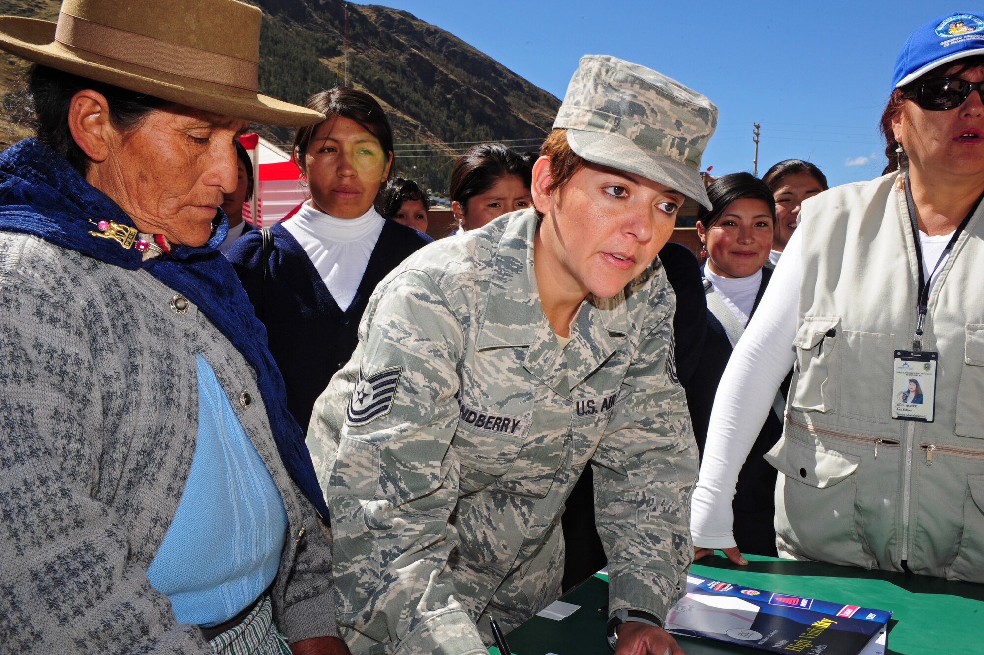 U.S. Air Force Tech. Sgt. Norma Grandberry, center, checks in a patient at an Expeditionary Medical Support mobile field hospital in Huancavelica, Peru, July 2, 2012, during New Horizons 2012. Grandberry, deployed from Langley Air Force Base, Va., is in Peru for training, and to provide humanitarian and medical services. (U.S. Air Force photo by Staff Sgt. Michael C. Zimmerman/Released)