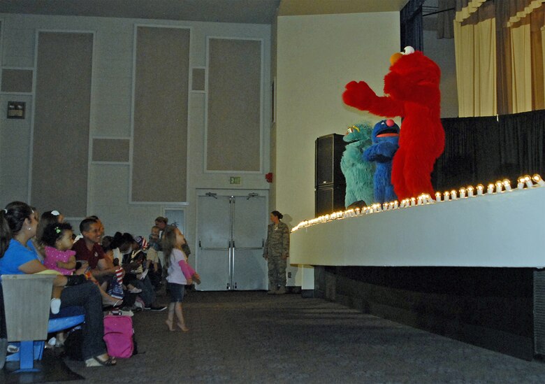 Characters from the Sesame Street/USO Experience for Military Families, a free traveling USO show, performed for Peterson Air Force Base military families July 8 and 9 at the base auditorium. (U.S. Air Force/file photo)