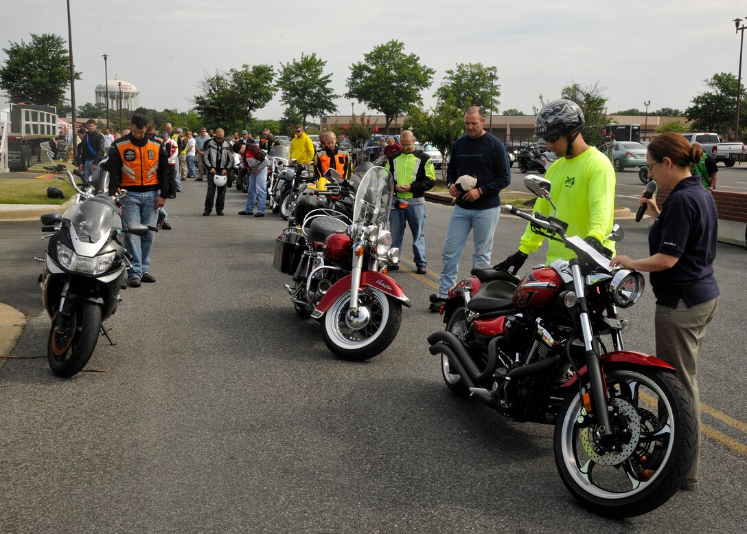Chaplain (Capt.) Sarah Schechter, 11th Wing Jewish chaplain, far right, gives opening remarks and a prayer prior to the start of Joint Base Andrews’ Motorcycle Safety Day on July 13. (U.S. Air Force photo/Senior Airman Lindsey A. Porter)