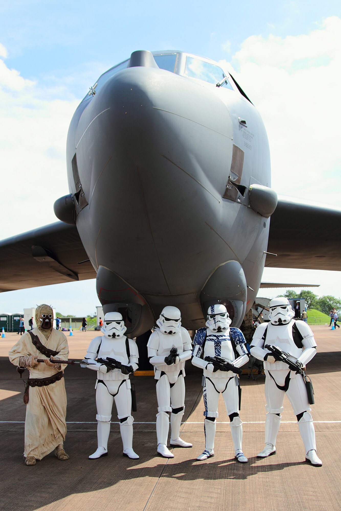A group of Imperial stormtroopers from the Galactic Empire and one lone Tusken Raider take a moment out of a hectic day of Galactic Civil War to pose for a photo beneath the nose of a B-52 Stratofortress at the Royal International Air Tattoo 2012, RAF Fairford, England, July 8, 2012. While under the command of the empire, many stormtroopers served alongside both Imperial Army and Navy units. For this group of elite soldiers, it was their first time to see the B-52 up close and personal. The Tusken was just tagging along for street creds. An aircrew and B-52 Stratofortress from the 93rd Bomb Squadron, 307th Bomb Wing were on hand at what is touted as the world’s biggest military air show from July 4-9, 2012. (Courtesy photo by Roel Reijne)