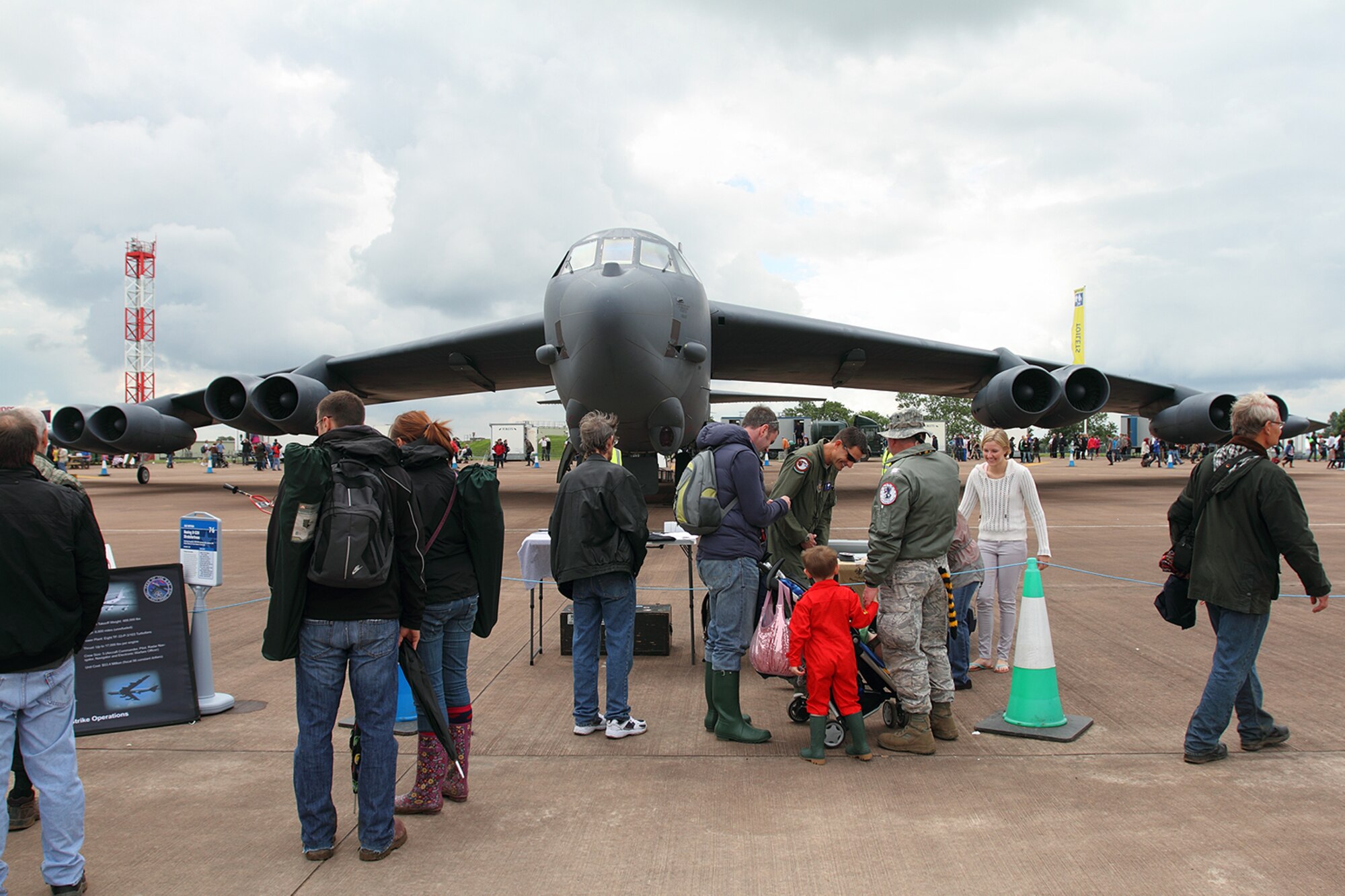 Maj. Pat Booker, a pilot assigned to the 93rd Bomb Squadron, 307th Bomb Wing, Barksdale Air Force Base, La., speaks with visitors to the Royal International Air Tattoo 2012, RAF Fairford, England, July 8, 2012. An aircrew and B-52 Stratofortress from the 307 BW were on hand at what is touted as the world’s biggest military air show from July 4-9, 2012. (Courtesy photo by Roel Reijne)