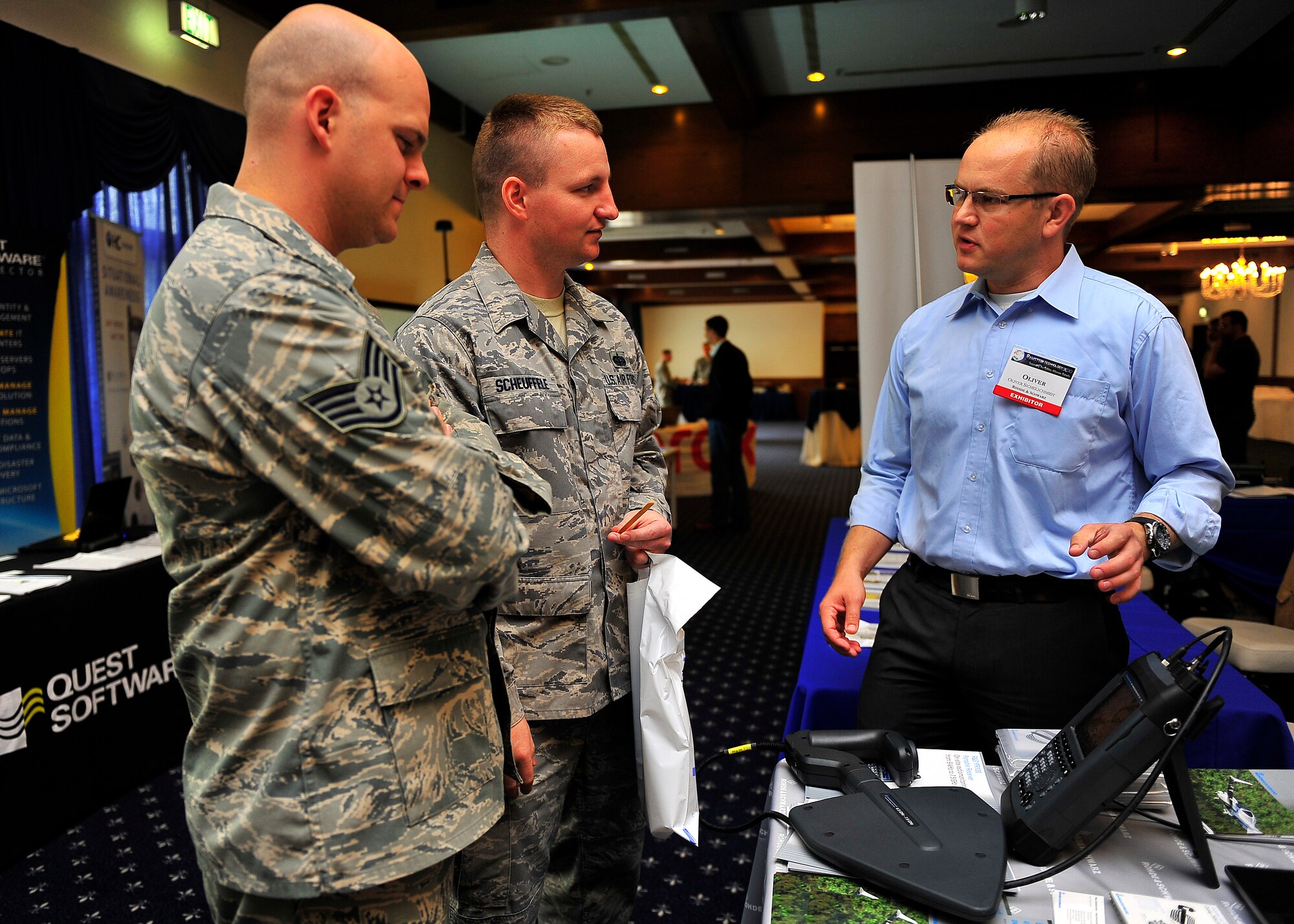 The Kaiserslautern Armed Forces Communications and Electronics Association, Chapter 158 hosted the 2012 Technology Expo at the Officer’s Club on Ramstein Air Base, Germany, July 17, 2012.  The event themed, ‘Discovering solutions for every mission’ wow’d more than 700 members of the KMC on the advances in modern technology in support of warfighting alliances globally.  Members discuss the changes in technology and the application to every day Air Force missions.  (U.S. Air Force photo/Staff Sgt. Daylena Gonzalez) 
