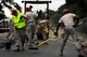U.S. Air Force Airmen assigned to the 823rd RED HORSE Squadron, sweep, shovel and rake as they perfect freshly laid asphalt on Aiken Street, Shaw Air Force Base, S.C., July 12, 2012. A team of 21 Airmen assigned to the 823rd RHS are slated to repave just over a mile of Shaw roadway. The 823rd RHS is an Air Combat Command asset assigned to the Ninth Air Force that operates out of Hurlburt Field, Fla. RED HORSE stands for Rapid Engineer Deployable Heavy Operational Repair Squadron Engineer. (U.S. Air Force photo by Senior Airman Kenny Holston/Released)  