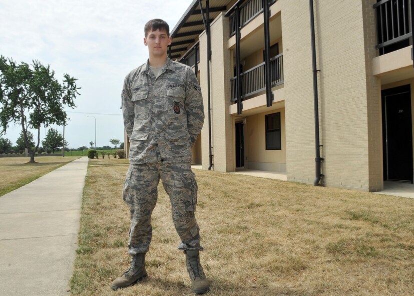 Airman 1st Class Michael Forry, a firefighter with the 436th Civil Engineer Squadron, stands in front of his dormitory, Building 445, July 13, 2012, on Dover Air Force Base, Del. Forry is the president of the 436th Mission Support Group dorm. (U.S. Air Force photo by Tech. Sgt. Chuck Walker)