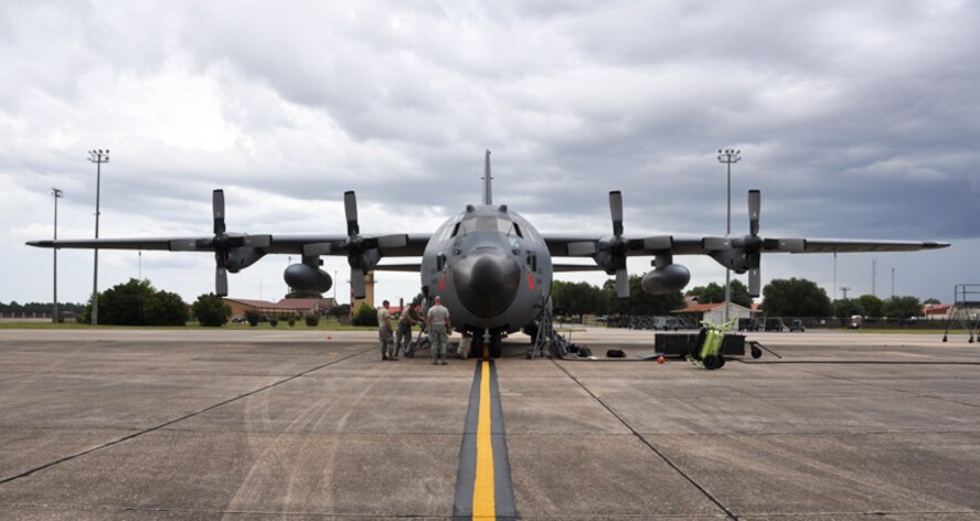 Members of the 94th Airlift Wing lift a C-130 Hercules using specialized jack stands to work on the front landing gear at Maxwell Air Force Base July 10. Members of the 94th AW were relocated form Dobbins ARB to Maxwell AFB as part of a mini deployment so that they could continue to train and remain combat ready. (U.S. Air Force photo/Senior Airmen Elizabeth Gaston)