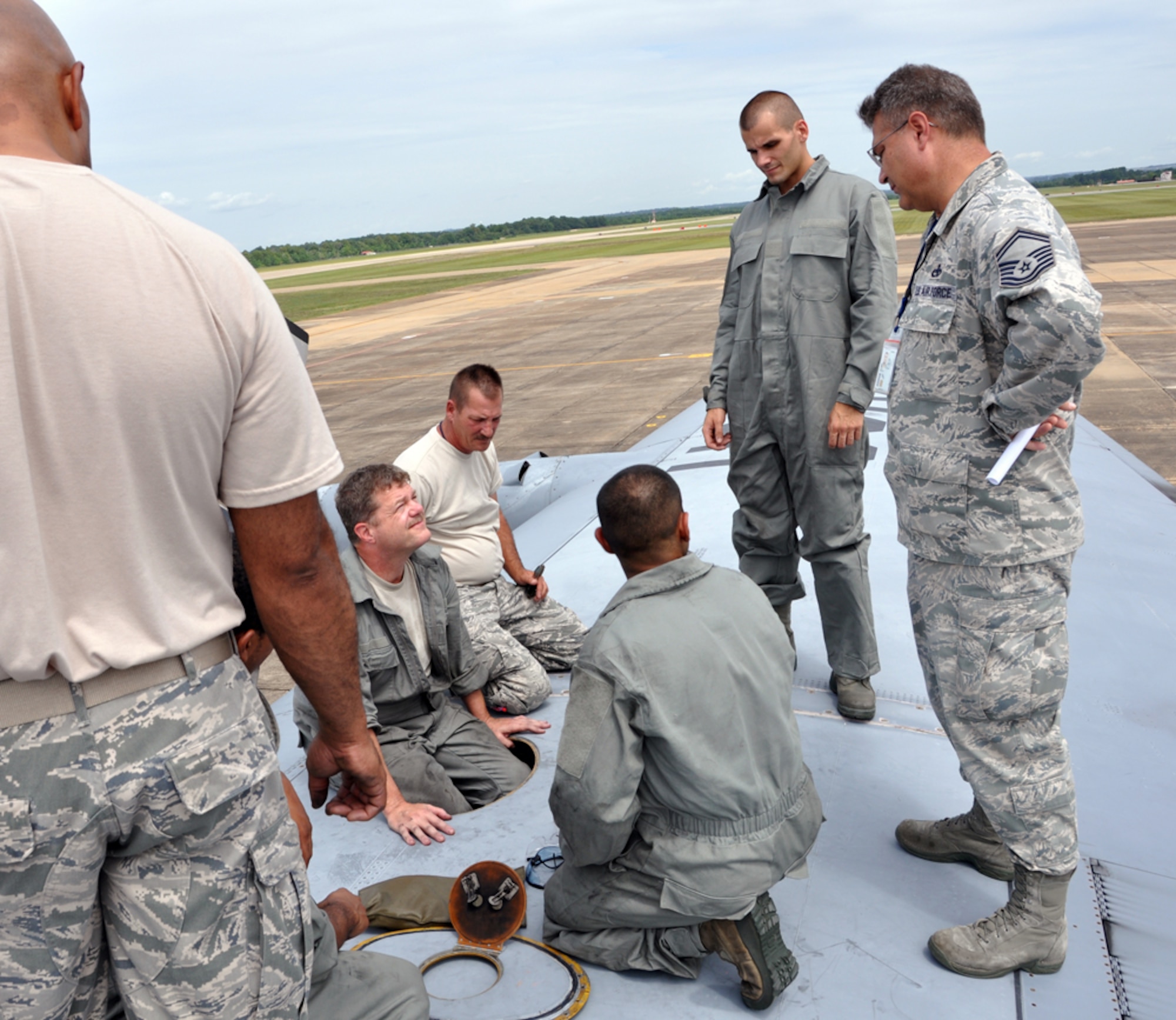 Senior Master Sgt. K. Scott Cook tells members of the 94th Maintenance Group what the plan will be for replacing a valve within the wing of a C-130 Herucules at Maxwell Air Force Base July 10. Members of the 94th AW were relocated form Dobbins ARB to Maxwell AFB as part of a mini deployment so that they could continue to train and remain combat ready. (U.S. Air Force photo/Senior Airmen Elizabeth Gaston)