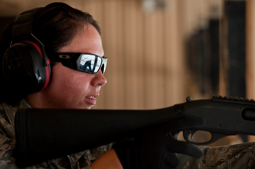 U.S. Air Force Staff Sgt. Jama Cohea, 7th Security Forces Squadron, prepares to shoot a MCS 870 shotgun during the qualification portion of the shotgun course July 13, 2012, at Dyess Air Force Base, Texas. To qualify, Airmen must shoot five rounds from the shotgun and have 25 of 45 pellets on a target 25 meters away, while shooting in the standing, over barricade and standing barricade position. The MCS 870 shotgun is a 12-gauge, pump action, manually operated, tubular magazine, internal hammered, air-cooled, shoulder fired weapon used for close-quarter-combat. The shotgun is also capable of being loaded with lethal and non-lethal rounds making it ideal for breaching and riot control. (U.S. Air Force photo by Airman 1st Class Damon Kasberg/Released)