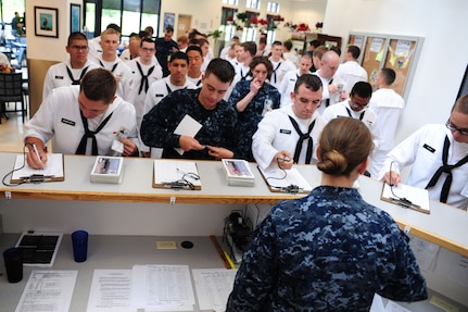 Sailors take a break from their studies as they prepare to eat lunch at the Galley at Joint Base Charleston - Weapons Station, S.C., July 13, 2012. The Galley serves approximately 3,000 meals a day to "A" School students as well as active duty and Reserve members working at JB Charleston - Weapons Station. (U.S. Air Force photo/ Airman 1st Class Chacarra Walker)
