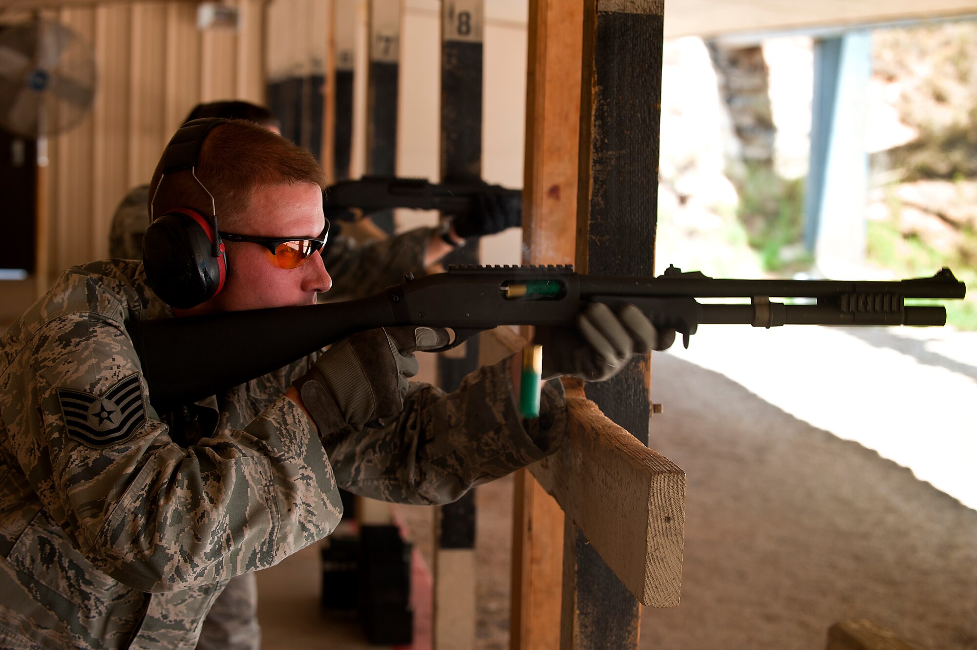Tech. Sgt. Ryan Tanner, 7th Security Forces Squadron, shoots a MCS 870 shotgun during the qualification portion of the shotgun course July 13, 2012, at Dyess Air Force Base, Texas. To qualify, Airmen must shoot five rounds from the shotgun and have 25 of 45 pellets on a target 25 meters away, while shooting in the standing, over barricade and standing barricade position. The MCS 870 shotgun is a 12-gauge, pump action, manually operated, tubular magazine, internal hammered, air-cooled, shoulder fired weapon used for close-quarter-combat. The shotgun is also capable of being loaded with lethal and non-lethal rounds making it ideal for breaching and riot control. (U.S. Air Force photo by Airman 1st Class Damon Kasberg/Released)