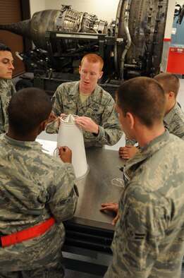 Tech. Sgt. James Peak, 22nd Maintenance Operations Squadron electrical environmental systems instructor and development NCO in charge, instructs Airmen on the proper way to change the coalescer on a water separator July 17, 2012, McConnell Air Force Base, Kan. As a development and electrical/environmental systems instructor, Peak develops and reviews course material and instructs courses. (U.S. Air Force photo/ Airman 1st Class Laura L. Valentine)