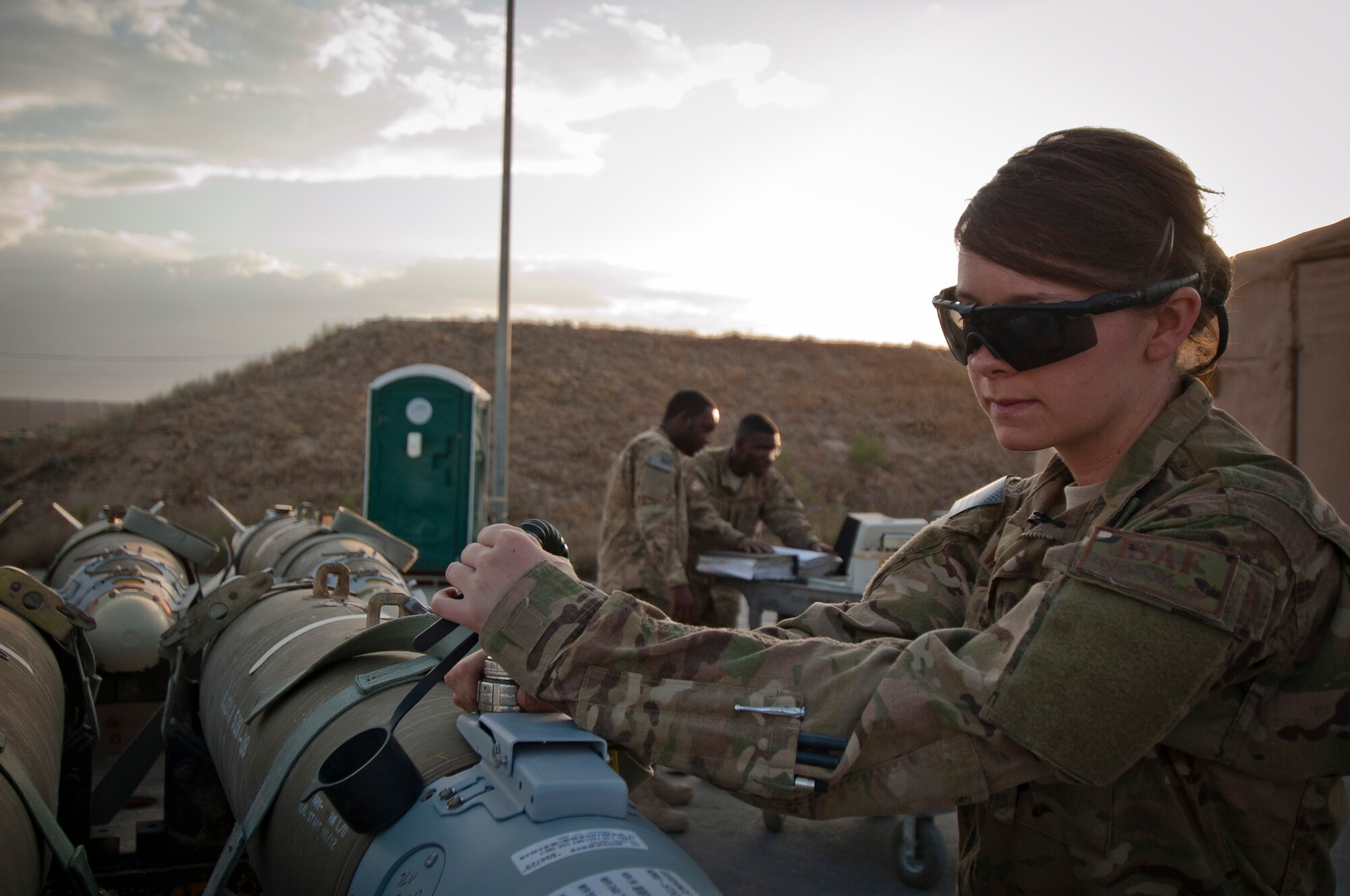 Airman 1st Class Mary Wiuff is a munitions systems specialist from the 188th Maintenance Squadron currently deployed with the 455th Expeditionary Maintenance Squadron, Bagram Airfield (BAF), Afghanistan. Wiuff checks a GBU-38 smart bomb’s guidance system June 23, 2012. Wiuff and her fellow maintainers sustain the fight by providing reliable, precise firepower to BAF’s aircrews. (U.S. Air Force photo by Capt. Raymond Geoffroy)