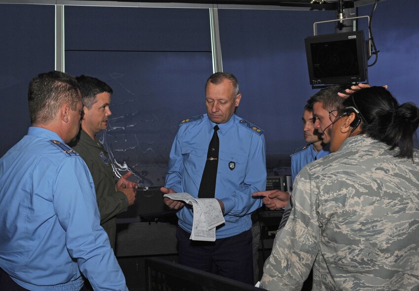 Members of Team Barksdale speak with Gen. Lt. Anatoliy Dmitriyevick Zhikharyev, Russian Long Range Aviation and Delegation commander, inside the control tower on Barksdale Air Force Base, La., July 11. Zhikharyev and members of his staff visited various units on Barksdale as part of a site survey. (U.S. Air Force photo/Airman 1st Class Benjamin Gonsier)(RELEASED)