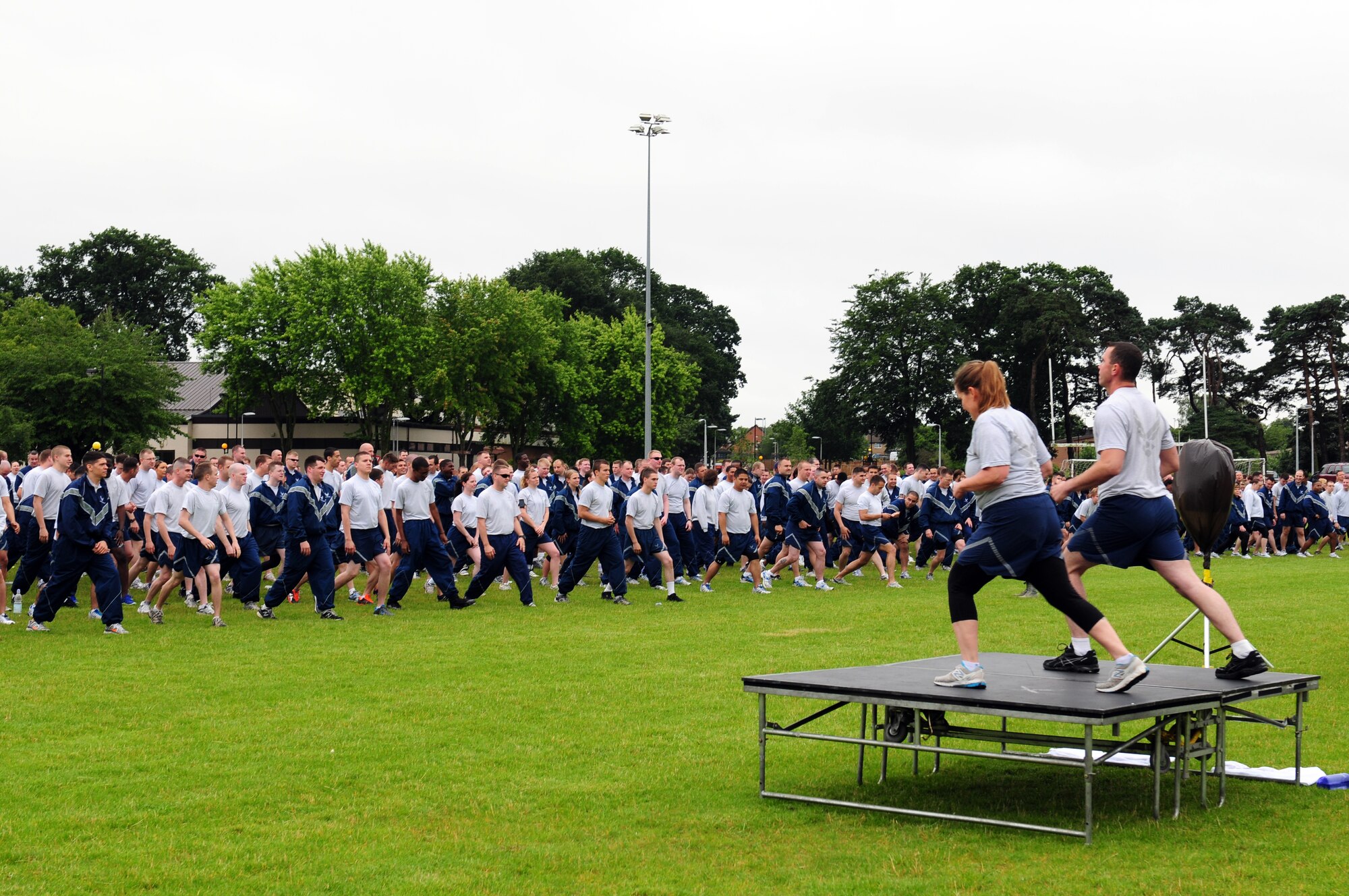 ROYAL AIR FORCE LAKENHEATH, England – Liberty Wing Airmen stretch before the official kick off of the Liberty Olympics July 13, 2012. The Liberty Olympics offered 48th Fighter Wing Airmen and their families a day of friendly competitions such as dodge ball, a 5K fun run, ultimate frisbee and other activities. (U.S. Air Force photo by Airman 1st Class Cory D. Payne)