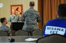 A simulated media representative asks Col. Al Wimmer, 35th Fighter Wing vice commander, questions concerning the simulated active shooter exercise during a press conference at Misawa Air Base, Japan, July 17, 2012.  After a major incident occurs on base, a press conference is held to answer any questions the media may have and make the public aware that leadership is doing everything they can to prevent these events from happening again.  (U.S. Air Force photo by Staff Sgt. April Quintanilla/Released)