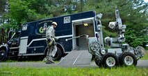 U.S. Air Force Senior Airman Matthew Thompson, 35th Civil Engineer Squadron explosive ordinance disposal technician, helps unload an EOD robot during an Emergency Management Exercise at Misawa Air Base, Japan, July 17, 2012. The use of robots takes EOD Airmen out of dangerous situations. (U.S. Air Force photo by Staff Sgt. Nathan Lipscomb/Released)