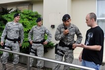 A witness provides 35th Security Forces Squadron Airmen with a description of a simulated shooter and his vehicle during an active shooter exercise at Misawa Air Base, Japan, July 17, 2012. Accurate and timely descriptions of active shooters help 35 SFS Airmen gather crucial information to find the suspect before they cause further harm to themselves or others.  Exercises such as these help prepare Airmen for real-world scenarios. (U.S. Air Force photo by Airman 1st Class Kia Atkins/Released) 