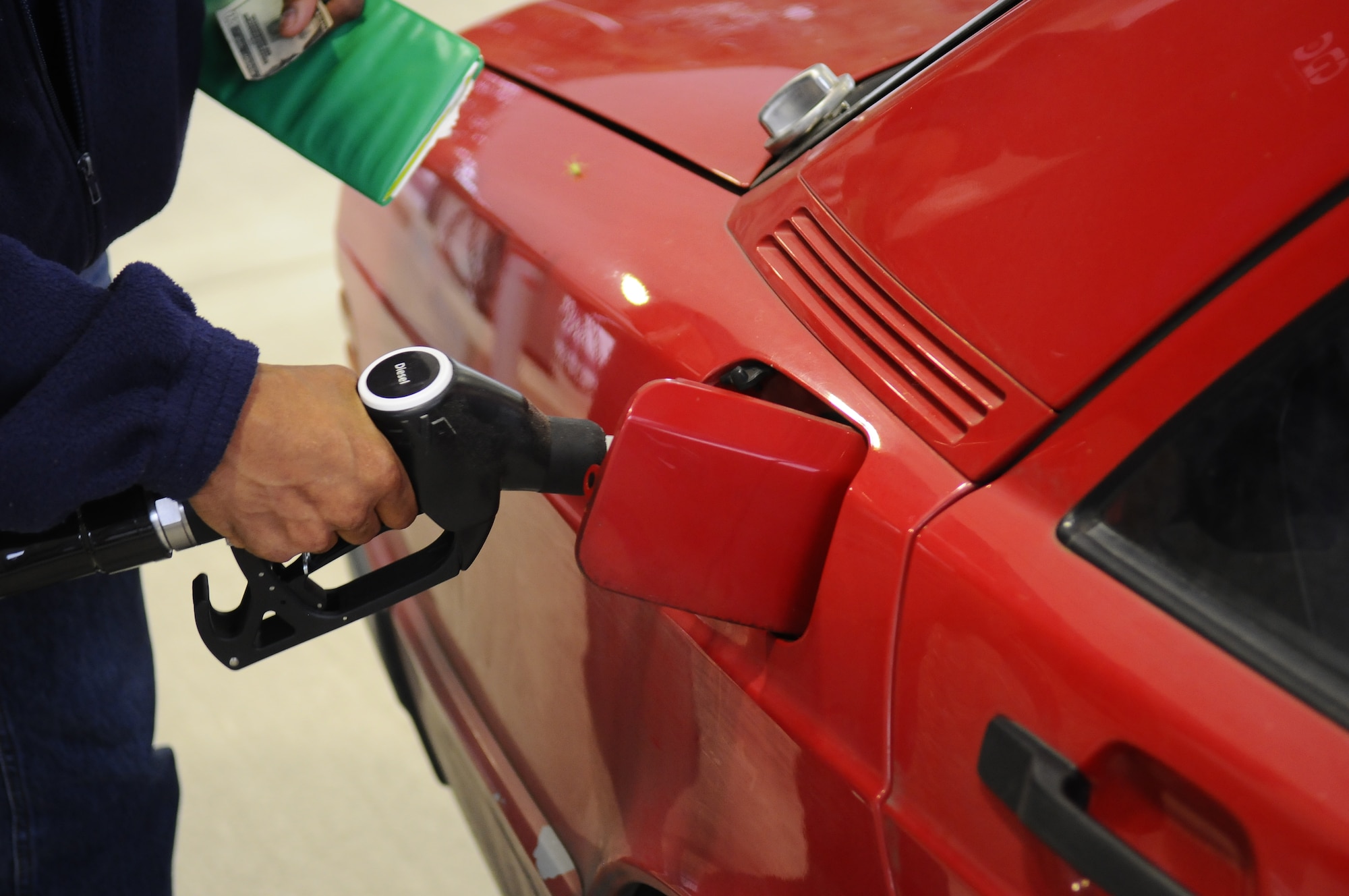 A patron fuels his car at the new RamExpress gas station on Ramstein Air Base, Germany, July 17, 2012. The new station has 28 pumps and will include diesel as an option. 