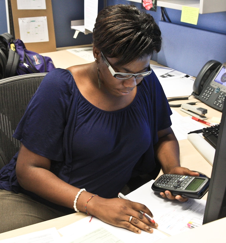 WIESBADEN, Germany -- Lakeevia Jackson, an Advancing Minorities Interest in Engineering (AMIE) student, working on an award package for an Environmental Compliance Support in the Environmental branch at the Amelia Earhart building here, July 10, 2012.