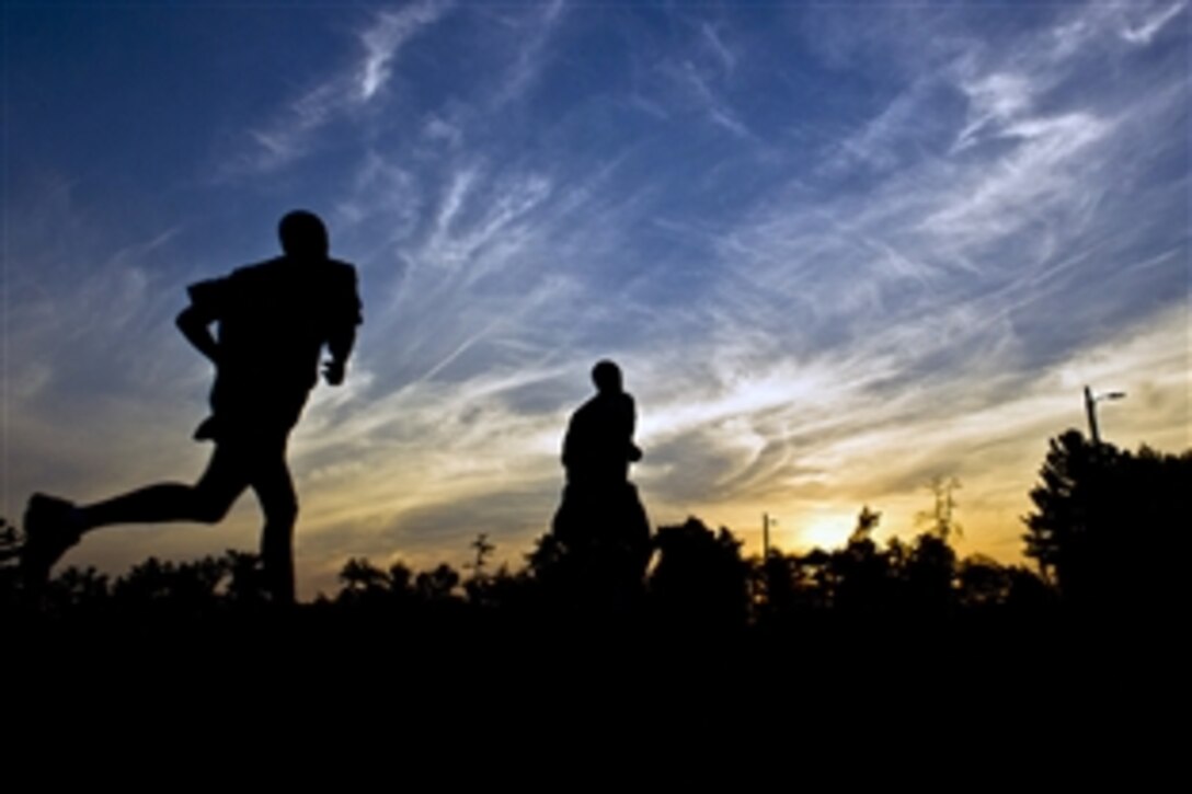 Troops compete in the 2-mile run event during the Army Physical Fitness Test as part of the 2012 U.S. Army Reserve Best Warrior Competition on Fort McCoy, Wis., July 16, 2012. The run is the first event in a grueling weeklong competition that will determine which two soldiers will represent the Army Reserve at next level of the Best Warrior Competition.