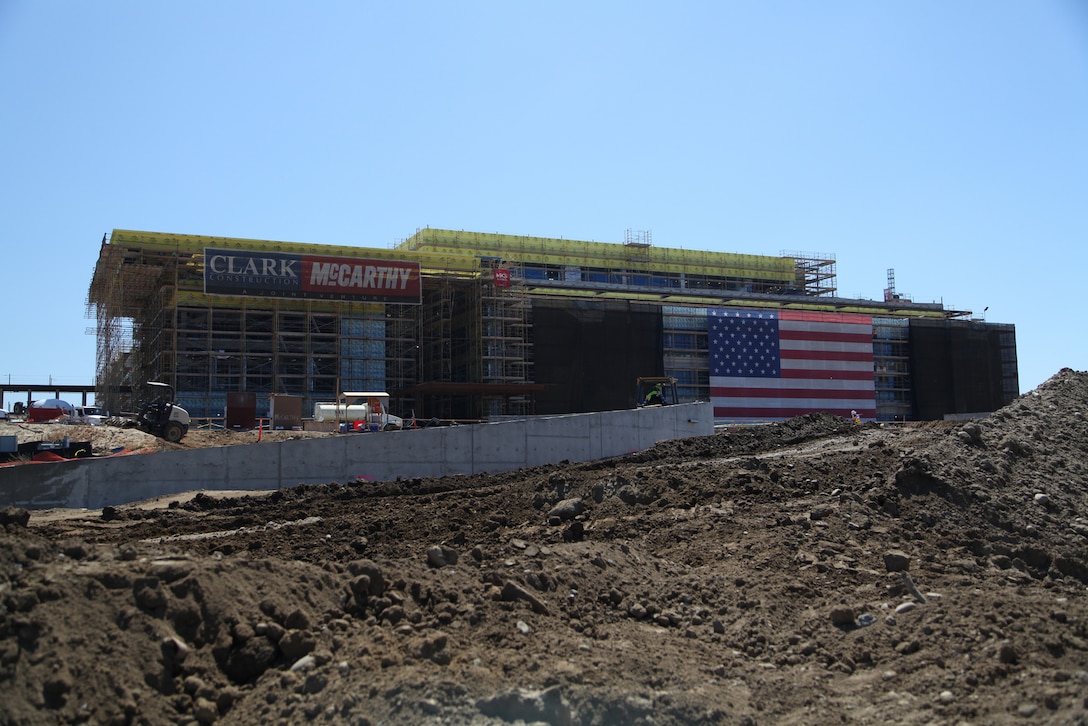 View of the Replacement Naval Hospital, Marine Corps Base Camp Pendleton, CA. The retaining wall will display the Hospital monument sign and borders the main entry from Vandergrift Blvd for both vehicle and pedestrian traffic