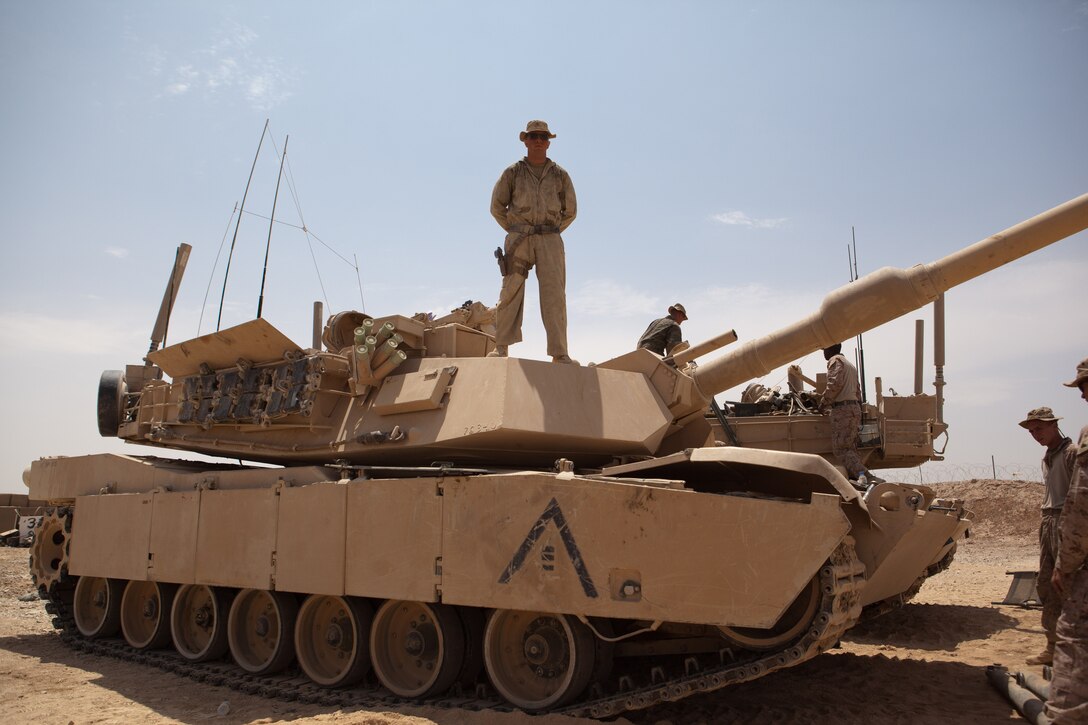 Corporal Kevin Quigley, tank crewman, Bravo Company, 2nd Tank Battalion, Regimental Combat Team 6, stands on top of an M1A1 Abrams tank, July 17, 2012. Quigley, from Emerson, N.J., said ?There?s nothing else like an M1A1 on the battlefield,? referring to a tank?s firepower and maneuverability over rough terrain. Quigley, and other Bravo Co. tankers said they are excited to be in Afghanistan, providing infantry Marines with support when they need it.