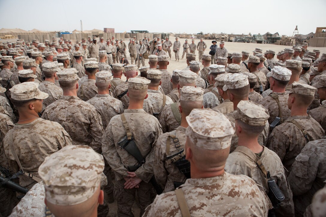 Marines from 2nd Battalion, 5th Marine Regiment, gather around Commandant of the Marine Corps Gen. James F. Amos at Combat Outpost Shir Ghazi, Afghanistan, July 17, 2012. General Amos and Sgt. Maj. of the Marine Corps Micheal P. Barrett visited Marines at six different locations in southern Afghanistan. They spoke about progress made in Helmand province as security responsibilities transition to Afghan forces. They both thanked the Marines for volunteering to serve and offered a glimpse into what the Marine Corps will look like in the not-too-distant future.