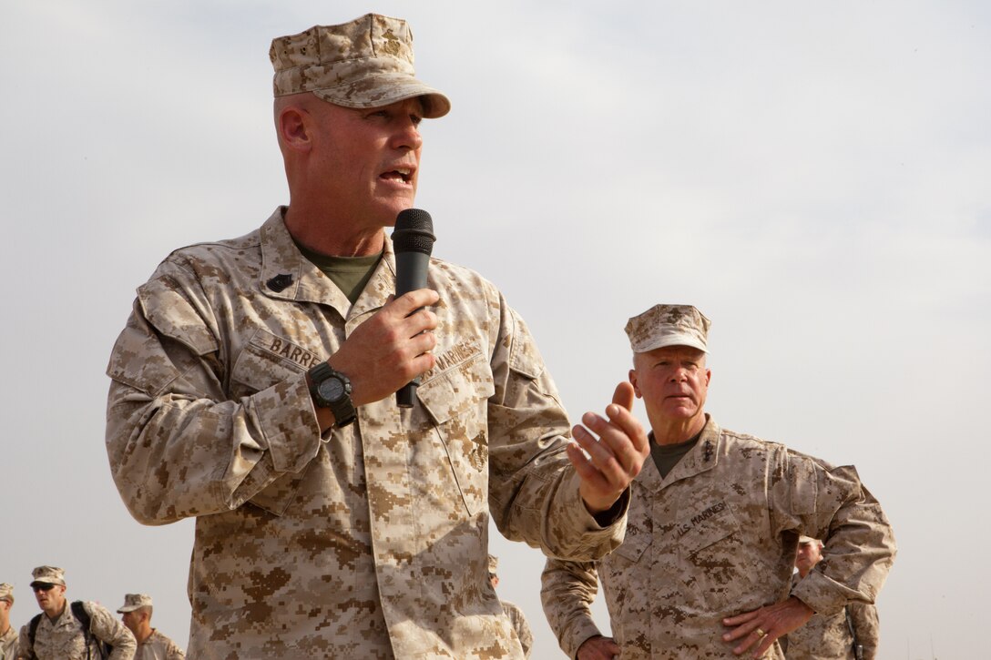 Sergeant Maj. of the Marine Corps Micheal P. Barrett addresses a crowd of Marines at Combat Outpost Shir Ghazi, Afghanistan while Gen. James F. Amos, commandant of the Marine Corps listens, July 17, 2012. Here, the two leaders met with Marines from 2nd Battalion, 5th Marine Regiment. General Amos and Sgt. Maj. Barrett stopped at six bases in Helmand province to thank Marines for their sacrifice and service as security responsibility in the region shifts to Afghan forces. As the Marine Corps starts to downsize its numbers from 202,000 Marines to 182,100 over the next four years, Sgt. Maj. Barrett tells Marines who want to stay in the Corps how to stay competitive for promotions.