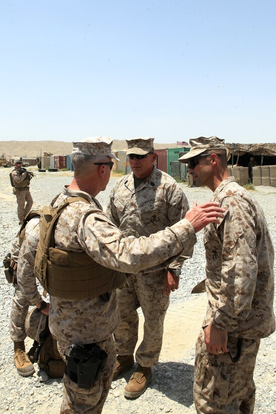 Lieutenant. Col. David Bradney, commanding officer, 1st Battalion, 7th Marine Regiment, and Sgt. Maj. Keith Coombs, the battalion sergeant major, greet Gen. James F. Amos, commandant of the Marine Corps, July 17, 2012. During their visit, Gen. Amos and Sgt. Maj. Micheal P. Barrett, sergeant major of the Marine Corps, spoke with the battalion’s leaders and took the opportunity to take photographs with Marines.