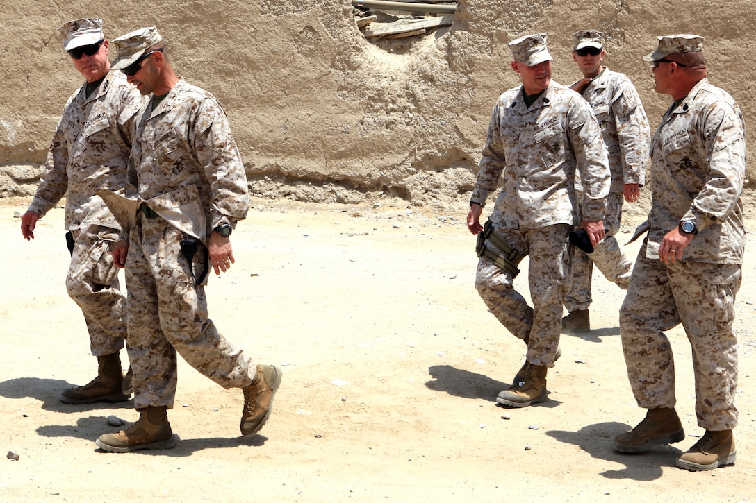 General James F. Amos, commandant of the Marine Corps, and Sgt. Maj. Micheal P. Barrett, sergeant major of the Marine Corps, speak with Lt. Col. David Bradney, commanding officer, 1st Battalion, 7th Marine Regiment and Sgt. Maj. Keith Coombs, the battalion’s sergeant major, July 17, 2012. During their visit, Gen. Amos and Barrett spoke with the battalion’s leaders and took the opportunity to take photographs with Marines.
