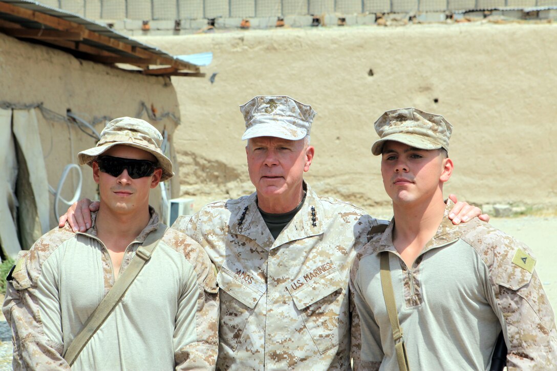 General James F. Amos, commandant of the Marine Corps, takes a picture with Marines from 1st Battalion, 7th Marine Regiment, July 17, 2012. During their visit, Gen. Amos and Sgt. Maj. Micheal P. Barrett, sergeant major of the Marine Corps, spoke with leaders of the battalion and took the opportunity to take photographs with Marines. 
