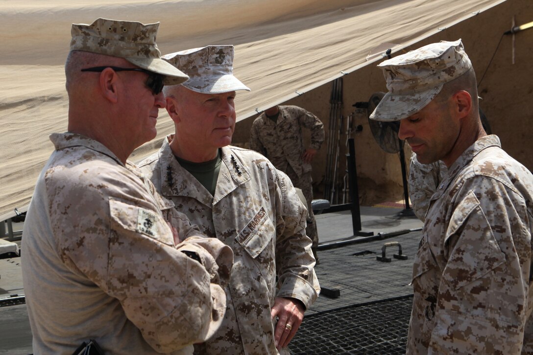 General James F. Amos, commandant of the Marine Corps, and Maj. Gen. Charles M. Gurganus, commanding general of Regional Command Southwest, speak with Lt. Col. David Bradney, commanding officer, 1st Battalion, 7th Marine Regiment, July 17, 2012. During their visit, Gen. Amos and Sgt. Maj. Micheal P. Barrett, sergeant major of the Marine Corps, spoke with leaders of 1st Bn., 7th Marines, and took the opportunity to take photographs with Marines of the battalion.