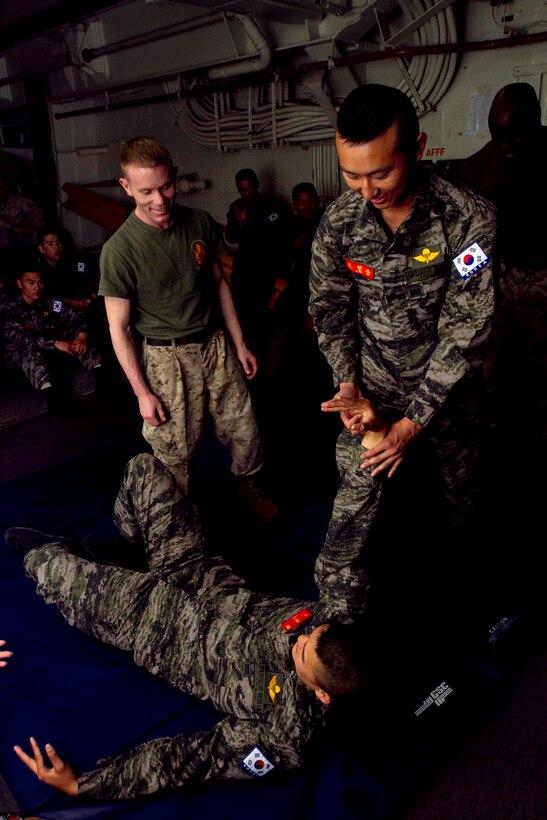 PACIFIC OCEAN -Republic of Korea Marines visiting USS New Orleans practice martial-arts techniques during a class with embarked members of the 11th Marine Expeditionary Unit here June 3. The visitors boarded the ship to sail to Hawaii for the Korean Marine Exercise Program 12-9, a regularly scheduled combined exercise involving a platoon of Republic of Korea Marines from 1st Company, 21st Battalion, 1st Marine Division, and U.S. Marine forces from 1st Battalion, 3rd Marines. This exercise will focus on strengthening the ROK-U.S. relationship while enhancing tactical interoperability and developing ROK Marine operational capabilities. , Cpl. Ryan Carpenter, 6/3/2012 3:48 AM