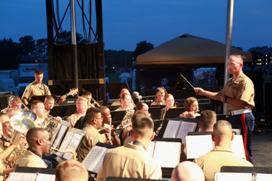 2nd Division Marine Band performs a patriotic playlist for the audience gathered in anticipation of the nights fireworks. The Band and the fireworks were part of the entertainment scheduled for Marine Corps Community Service's July Fourth Celebration at W.P.T. Hill field aboard Marine Corps Base Camp Lejeune July 4.