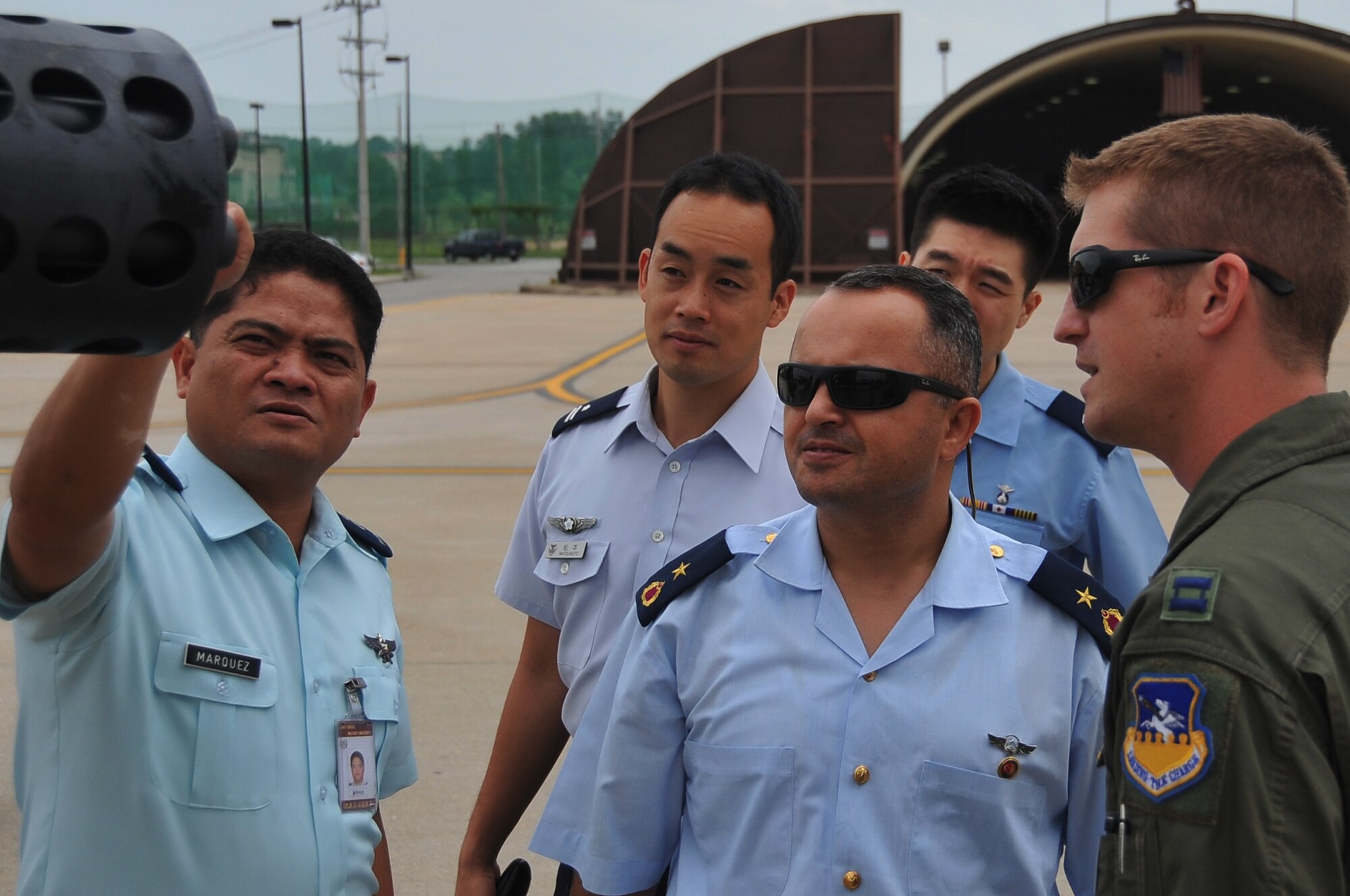 Capt. Clay Quinby (right), gives an overview of an A-10 Thunderbolt II Gatling-gun at Osan Air Base, Republic of Korea, July 17, 2012. The international pilots toured the 25th Fighter Squadron as part of their learning experience while attending the Republic of Korea Joint Military University. Quinby is a 25th Fighter Squadron A-10 Thunderbolt II pilot. (U.S. Air Force photo/Staff Sgt. Craig Cisek)