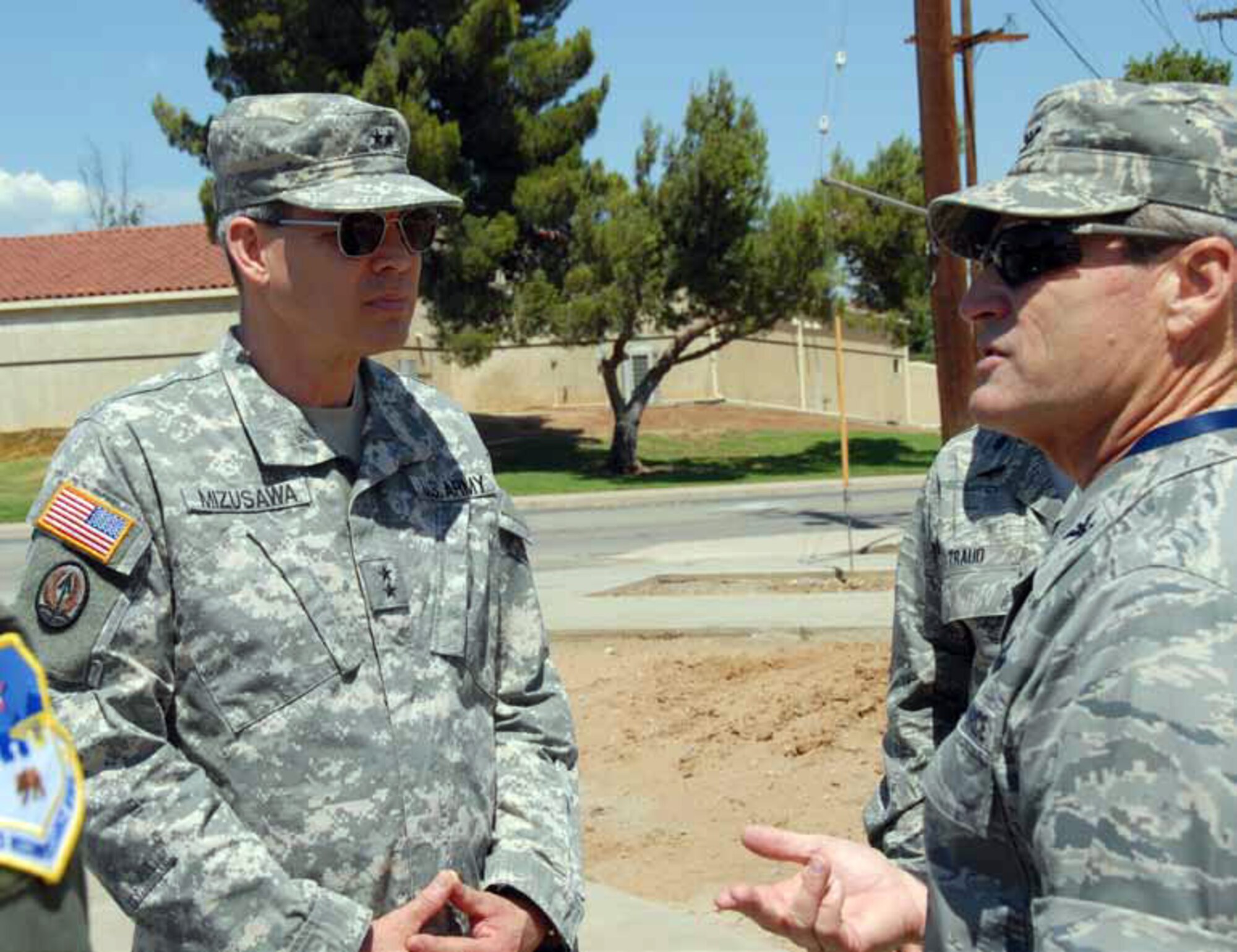 Col. Randall Ball, 163rd Reconnaissance Wing commander, briefs Major General
Bert Mizusawa (left), Assistant to the Chairman, JCS, for Reserve Matters, on the Air National Guard’s mission at the base during a 163d RW’s tour on July 10. General Mizusawa also learned about the 452 AMW’s operations, visited the 701st Combat Operation Squadron and was updated on the activities of the U.S. Army’s 358th Civil Affairs Brigade. (U.S. Air Force photo by TSgt Neil Ballecer)