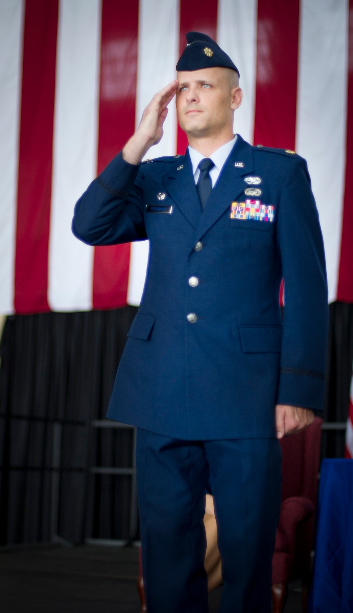 YOKOTA AIR BASE, Japan -- Maj. Nicholas Pedersen, the new 374th Aircraft Maintenance Squadron commander, renders his first salute to his unit during an assumption of command ceremony at Yokota Air Base, Japan, July 13, 2012. Pedersen renders the salutes as a symbolic gesture to take command of his squadron.(U.S. Air Force photo by Staff Sgt. Stacy Moless)  