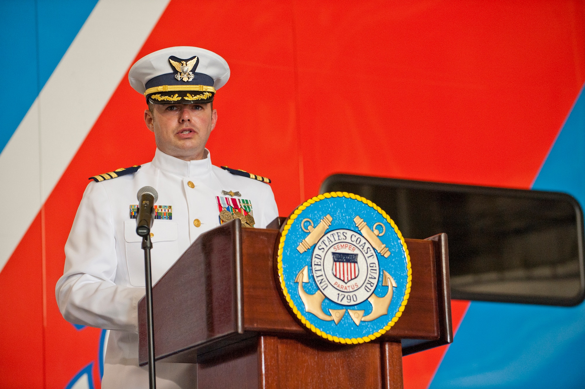 Commander Eric J. Doucette, United States Coast Guard Atlantic Strike Team incoming commanding officer, speaks at the change of command ceremony July 13 here. Doucette received command from Commander Richard J. Schultz. The Atlantic Strike Team can rapidly deploy and assist in minimizing adverse impacts from oil discharges, hazardous materials releases and weapons of mass destruction incidents. (U.S. Air Force photo by Russ Meseroll/Released)