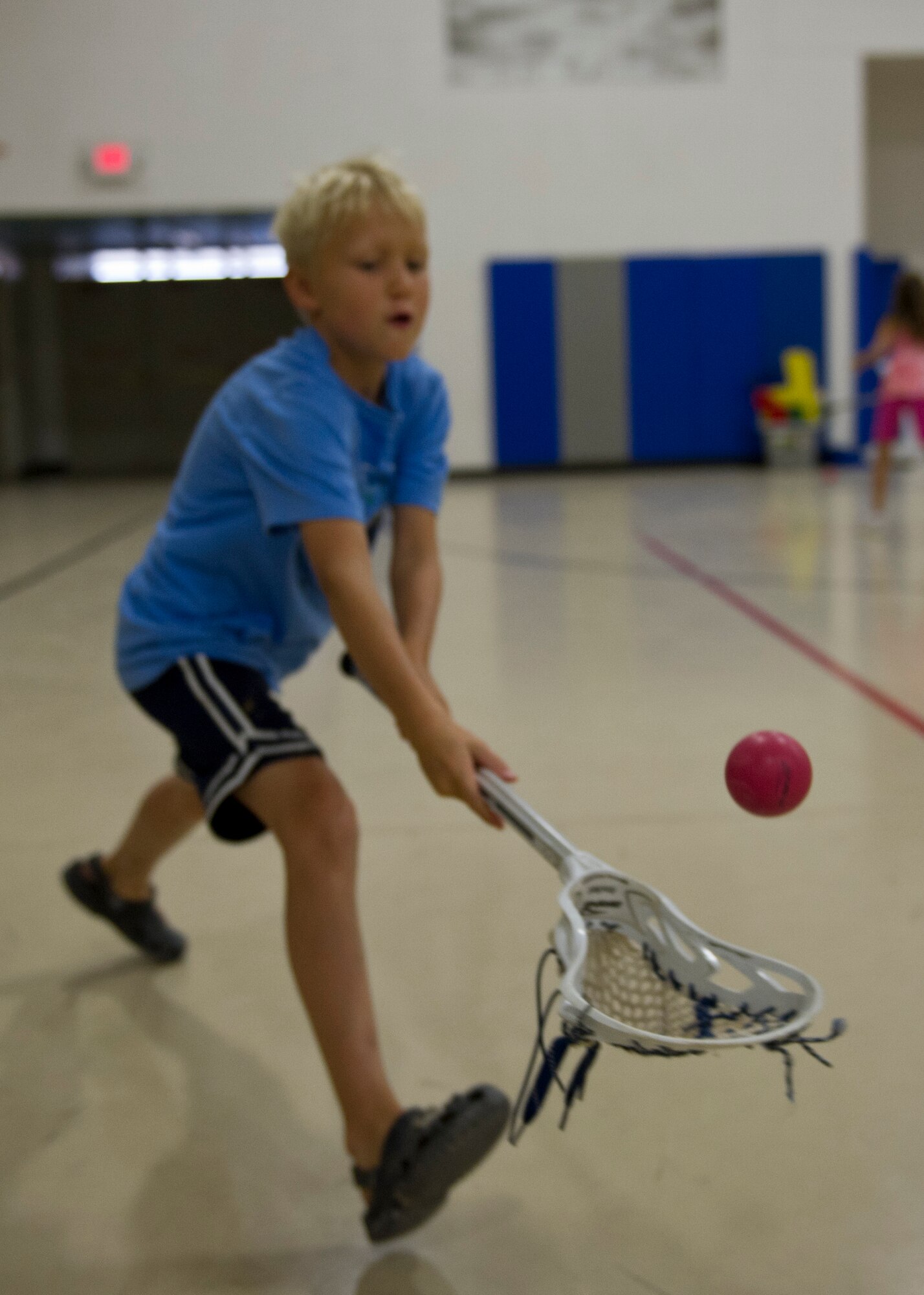 Will Hankins, 8, son of Lt. Col. Dawn Hankins, 49th Wing staff judge advocate, catches a lacrosse ball during a Sideline Sports Camp at Holloman Air Force Base, N.M., July 13. Hankins was one of more than 20 children of Team Holloman who participated in the camp, which aims to expand each participant’s understanding of non-traditional sports, improve physical fitness, and develop an appreciation for the various sports offered. Each day of the camp, the Sideline Sports instructors introduced a new sport to the participants, including ultimate frisbee, handball, badminton, fencing and lacrosse. (U.S. Air Force photo by Senior Airman Siuta B. Ika/Released)