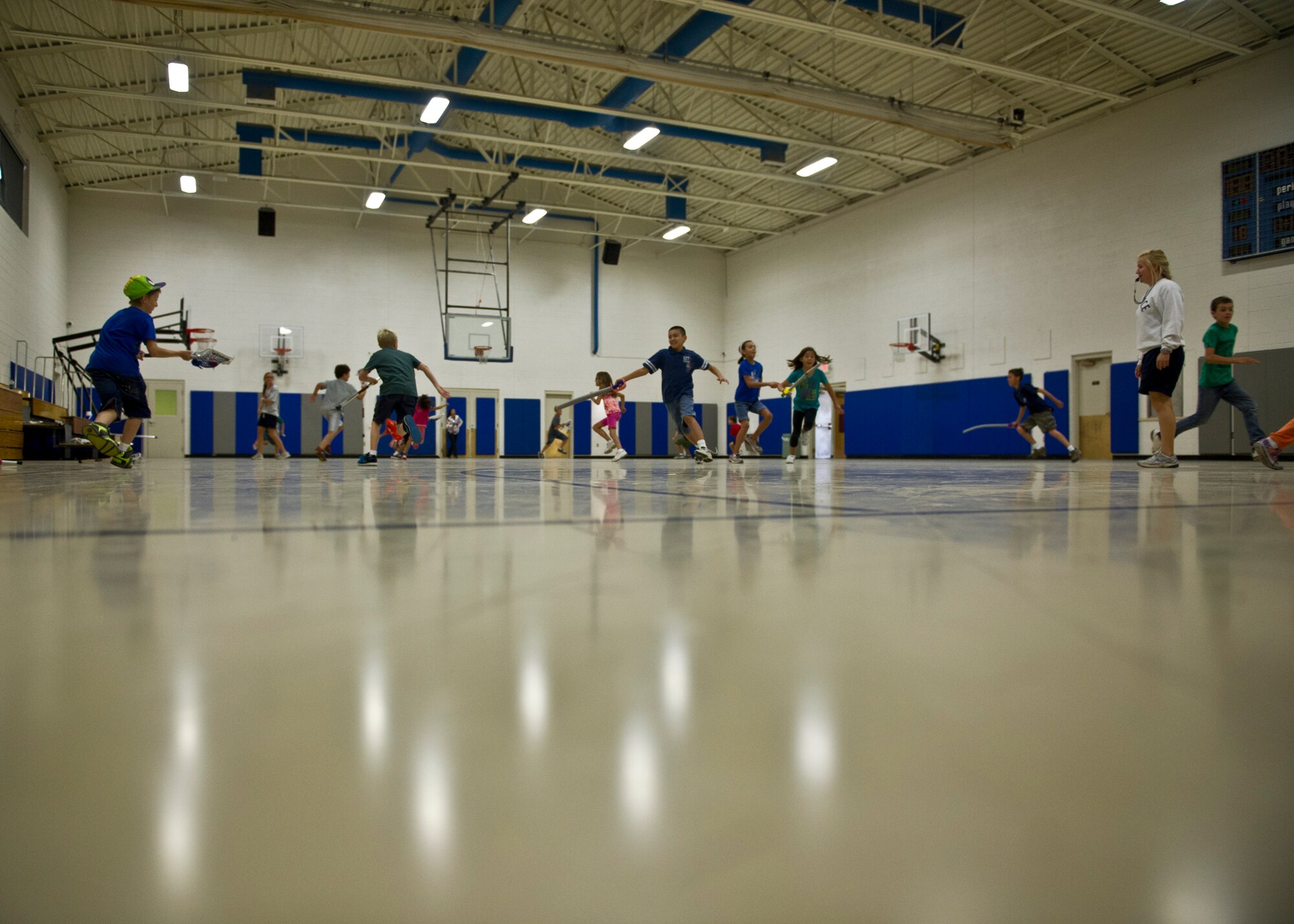 Children play lacrosse during a Sideline Sports Camp at Holloman Air Force Base, N.M., July 13. The goal of the camp, which took place July 9-13, is to expand each participant’s understanding of non-traditional sports, improve physical fitness, and develop an appreciation for the various sports offered. Each day of the camp, the Sideline Sports instructors introduced a new sport to the participants, including ultimate frisbee, handball, badminton, fencing and lacrosse. (U.S. Air Force photo by Senior Airman Siuta B. Ika/Released)