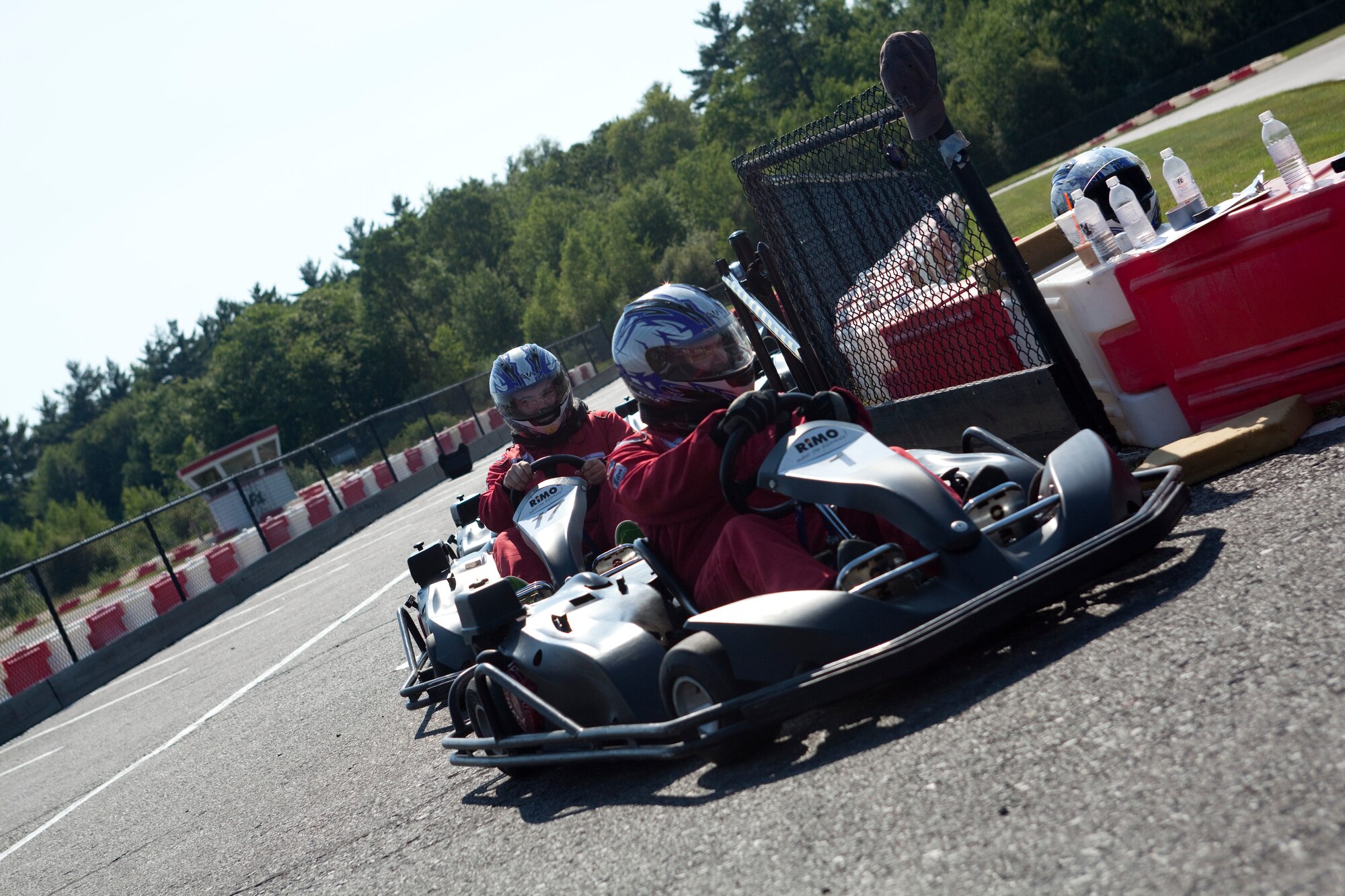 Racers from all over the 102nd Intelligence Wing gathered to cheat death at speeds of almost 50 miles per hour. The Commander’s Cup Racing Event consisted of an 8 lap practice, an 8 lap qualifying round and a 10 lap Championship Race.  For the Cup, points were awarded based on your finishing position. One additional bonus point was added for the driver with the fastest lap, the fastest top speed, and if you were the Wing Commander participating in your final commander’s cup event. (Air National Guard photo by Senior Airman Jeremy Bowcock/Released)