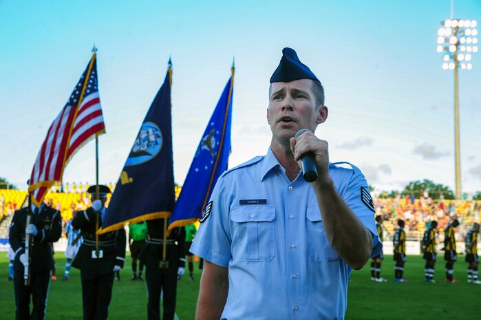 Staff Sgt. Timothy Womble, 437th Maintenance Group quality assurance technician, sings the National Anthem during the Charleston Battery soccer team's military appreciation night held at Blackbaud Stadium on Daniel Island, S.C., July 14, 2012. The Charleston Battery traditionally holds two military appreciation nights a season. (U.S. Air Force by Staff Sgt. Nicole Mickle)