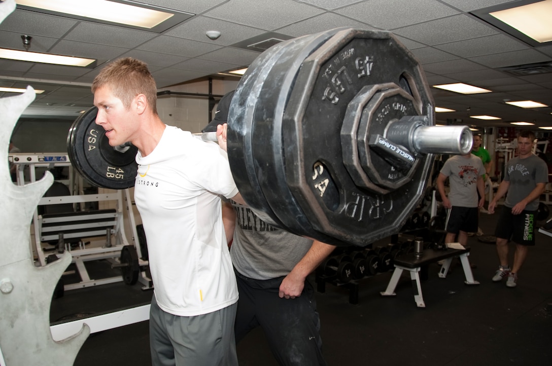 A participant of the ENJJPT weightlifting competition about to attempt a heavy back squat on July 13, 2012 at the ENJJPT weight room. The weightlifting competition was one of two competitions that helped raise money in honor of Capt. Francis Imlay.  