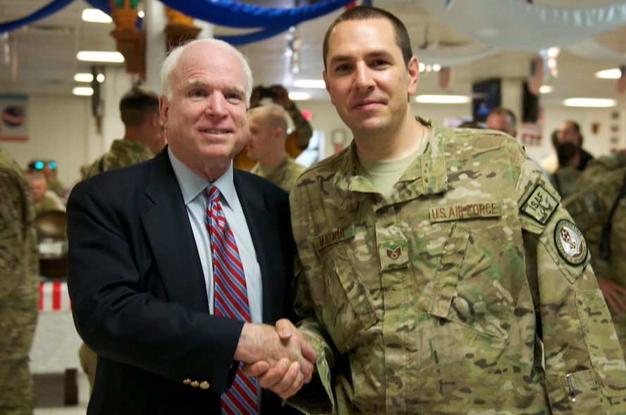 Arizona Sen. John McCain shakes hands with Staff Sgt. Michael Matkin, deployed from the 161st Air Refueling Wing, Phoenix, in Bagram Air Field July 4, 2012. McCain spent the afternoon meeting with constituents, conducting a promotion and re-enlistment ceremony, and visiting the Craig Joint Theater Hospital. (U.S. Army photo by SPC Kenneth Scar/Released)