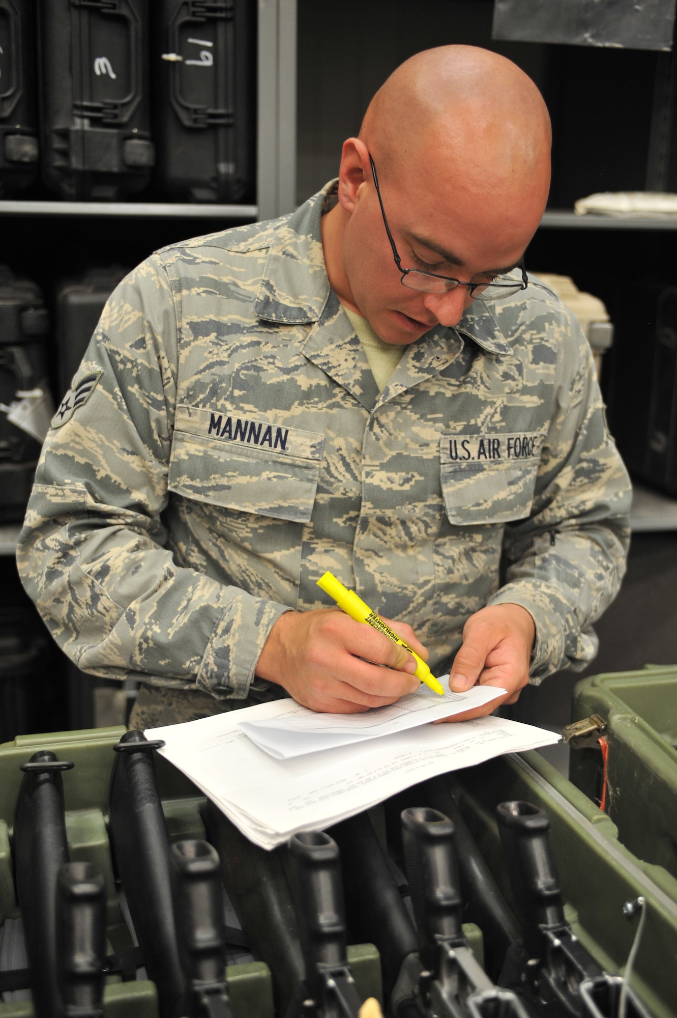 U.S. Air Force Senior Airman Levi Mannan, 27th Special Operations Logistics Readiness Squadron material management flight, varifies inventory for thousands of weapons at Cannon Air Force Base, N.M., July 17, 2012. The material management flight stocks and issues 26,000 line items of supplies and equipment, including mobility bags and weapons. (U.S. Air Force photo/Airman 1st Class Eboni Reece)