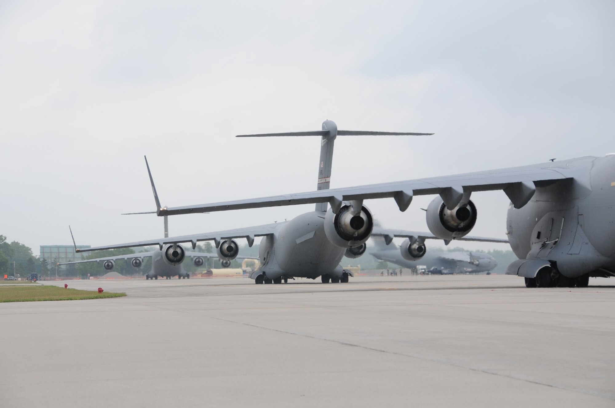 WRIGHT-PATTERSON AIR FORCE BASE, Ohio - Four C-17 Globemaster III aircraft prepare to depart Wright-Patterson Air Force Base, Ohio, as part of a 445th Airlift Wing training exercise July 14. The exercise was held to prepare aircrews and maintenance personnel for its upcoming operational readiness inspection.
(U.S. Air Force photo/Tech. Sgt. Anthony Springer)
