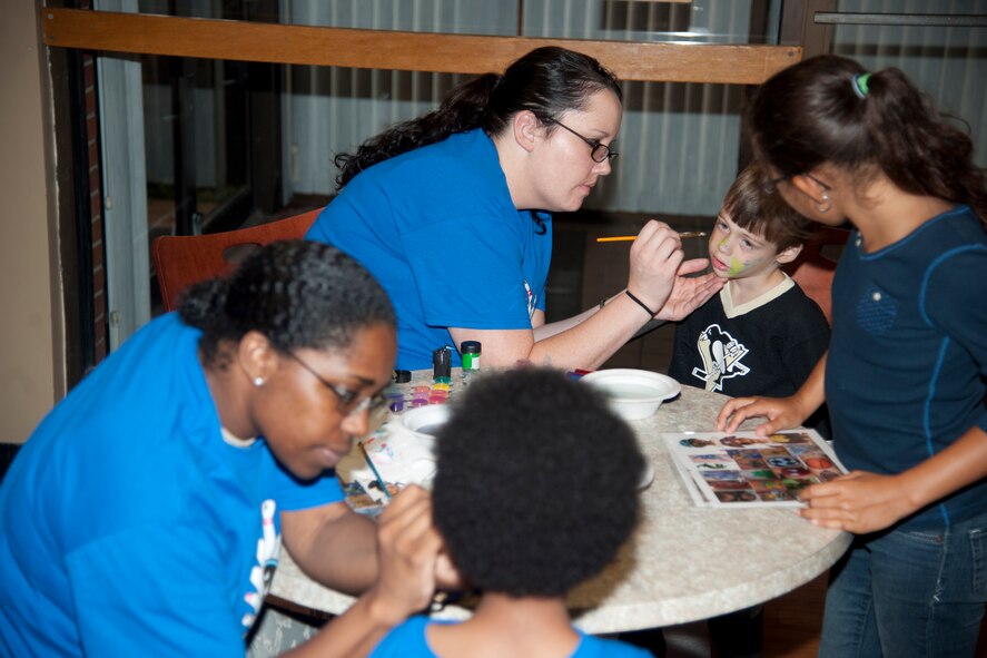 Volunteers paint children’s faces during an Exceptional Family Members Program event July 17, 2012, at Moody Air Force Base, Ga. Kids bowled, ate and got their faces painted while their parents learned about various EFMP services. (Airman 1st Class Paul Francis/Released)
