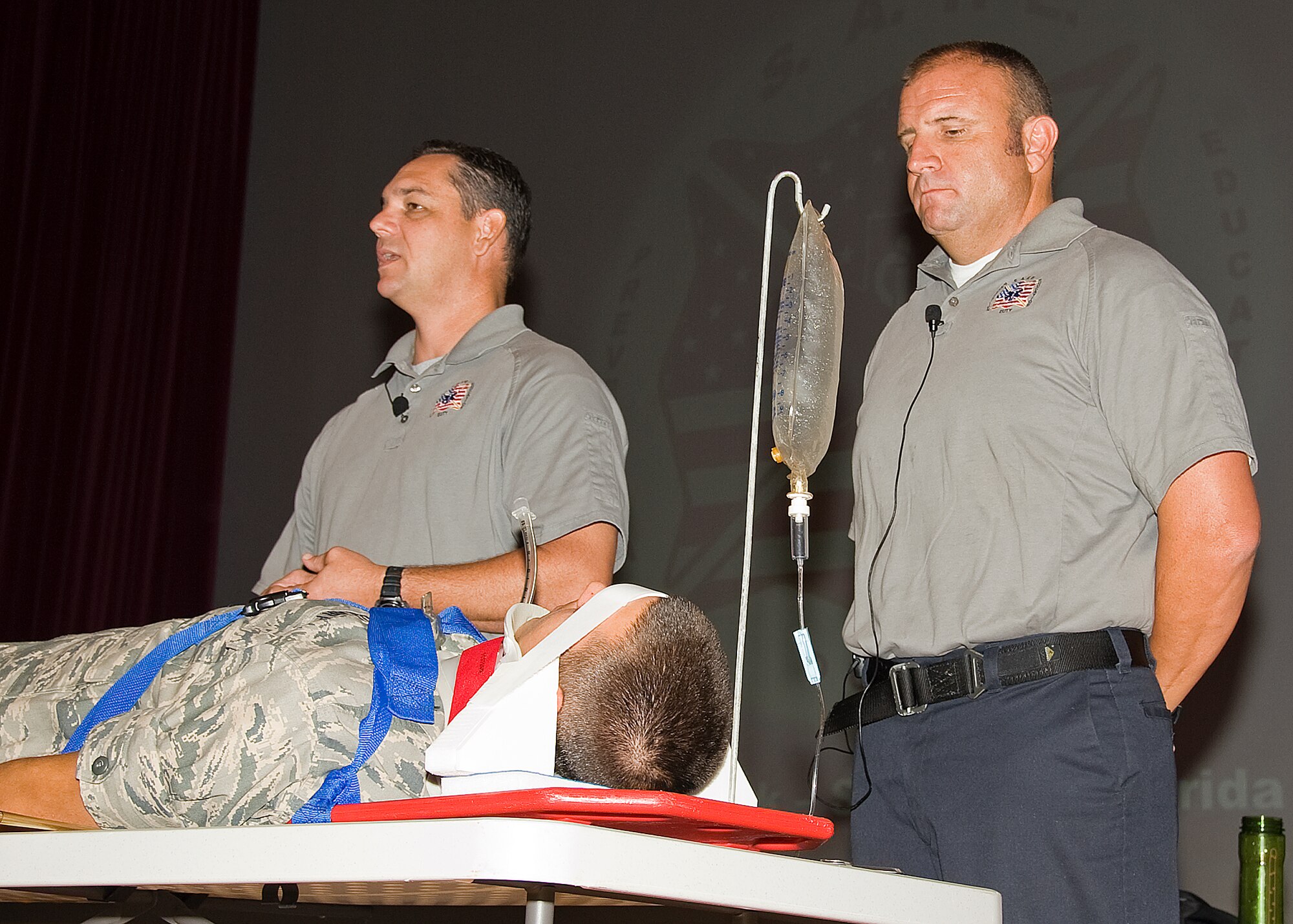 Scott Neusch and Pat Kelly of the Florida SAFE program present “Street Smart” a visual, educational and graphic reality of unsafe driving. Airman Basic Lucas Lyman of the 362nd Training Squadron volunteered to be the accident victim on 12 July, 2012 at the Sheppard Theater. (U.S. Air Force photo/Frank Carter)