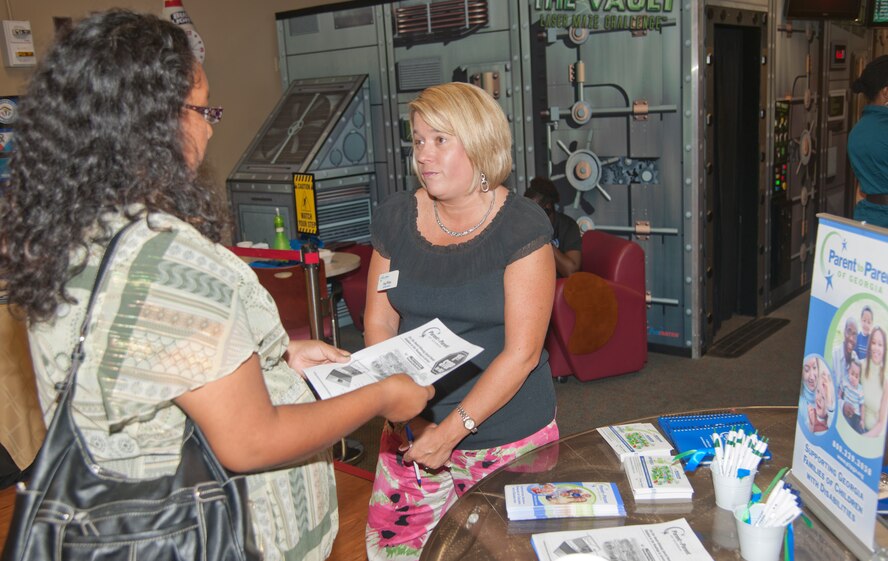 Amy White, South Georgia Parent to Parent coordinator, talks to a parent who attended an Exceptional Family Members Program event at Moody Air Force Base Ga., July 17, 2012. The EFMP connects active duty family members who have special needs with many helping agencies both on- and off-base. (Airman 1st Class Paul Francis/Released)
