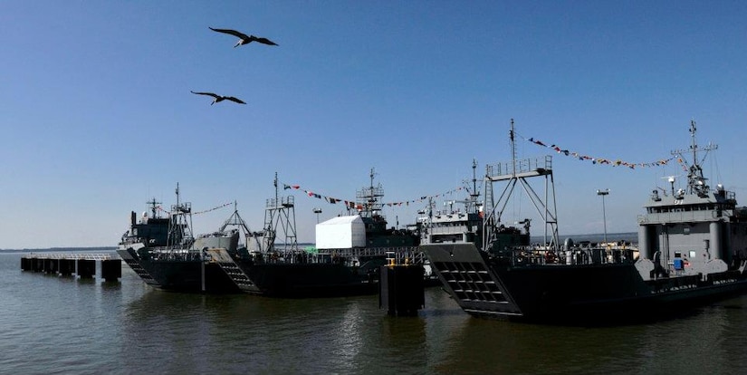 Three Army landing craft utility vessels docked at 3rd Port, Fort Eustis
wait for their next assignment at sea. Sgt. Justin Kaplan, a senior engineer
assigned to the 97th Transportation Company, 10th Transportation Battalion,
7th Sustainment Brigade, works in the engine-rooms of a vessel like these. (U.S. Army photo by Staff Sgt. Alexander Burnett/Released)