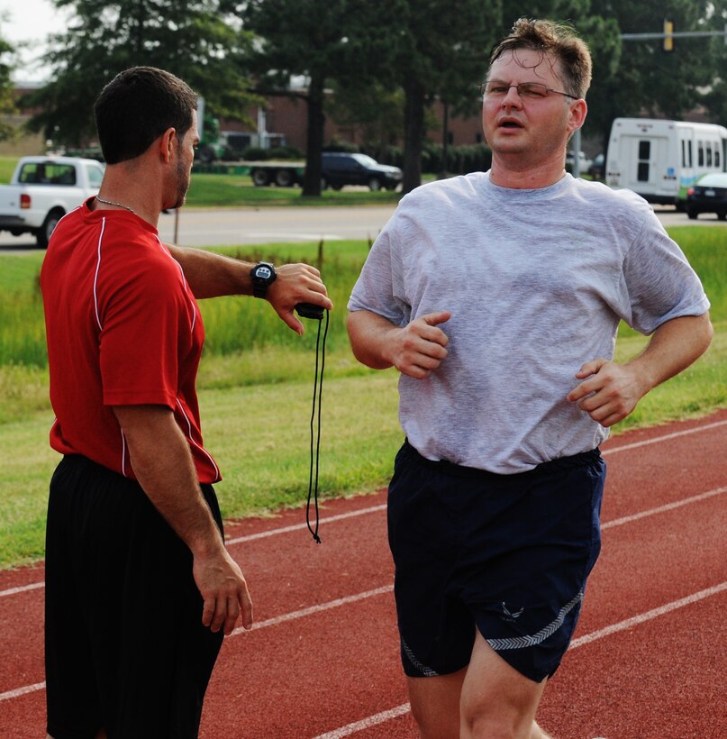 Capt. David Barnes, running clinic participant, finishes a half-mile run July 9 at Langley Air Force Base, Va. The Health and Wellness Center suggests a 90-day progression program for individuals interested in shortening their run times. (U.S. Air Force photo by Airman 1st Class Austin Harvill/Released)